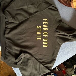 Fear of God Black Hoodie with Gold Lettering